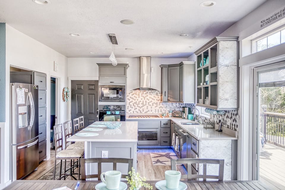 Your gourmet kitchen awaits with gleaming countertops, modern appliances, and charming details that make cooking a joy.