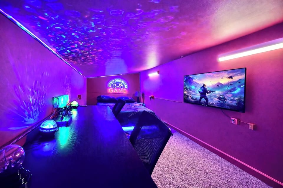 Step into your own neon-lit escape—game, relax, and unwind in this immersive arcade-style room where every night feels like a private experience.