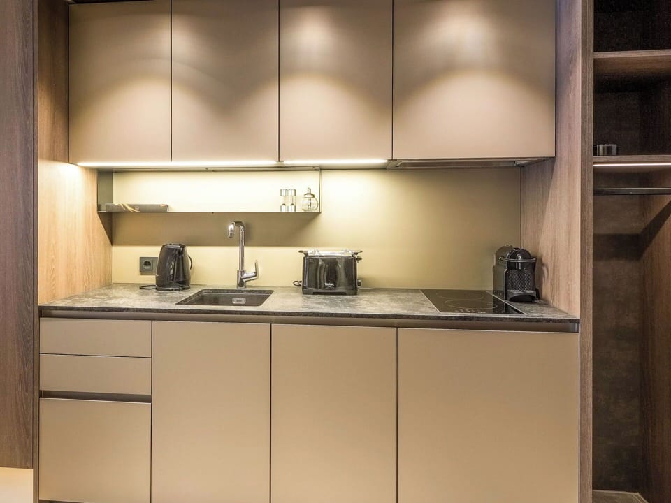 Kitchen, Interior Design, Kitchen Appliance, Countertop, Cabinetry, Furniture, Flooring, Major Appliance, Home Appliance, Wood Stain