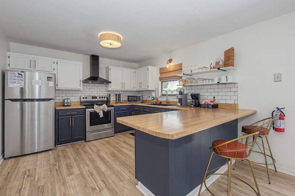 Your spacious kitchen features modern appliances, a large island for meal prep, and everything you need to create memorable dining experiences.