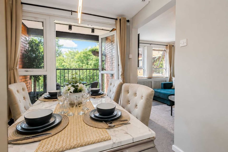 Dining Room: Enjoy meals at this stylish wooden table, surrounded by stunning floral accents!
