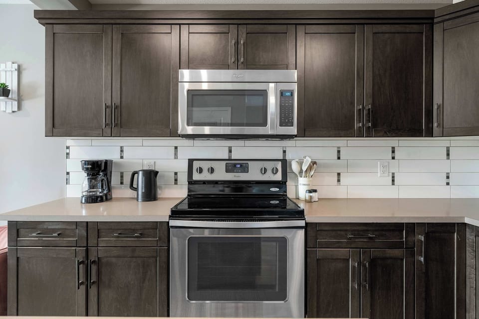 Stainless steel appliances and backsplash