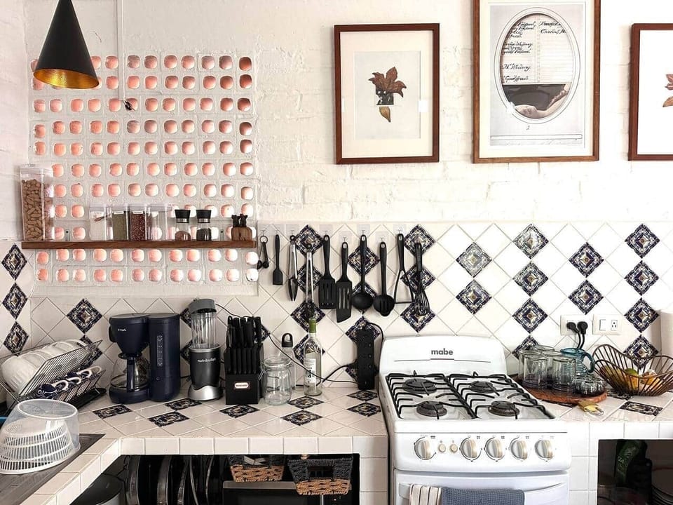 Charming tiled kitchen with a practical, well-equipped layout — designed for easy cooking, morning coffee, and everyday comfort.