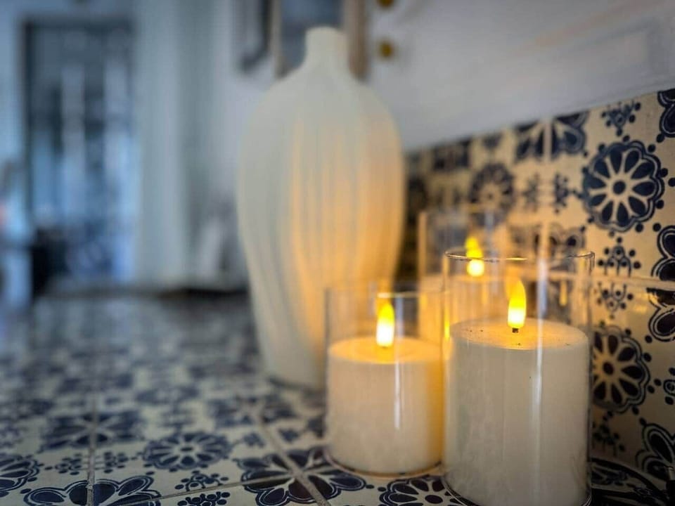 Soft electric candlelight on handcrafted tile — a warm, ambient glow for slow evenings and relaxed moments.