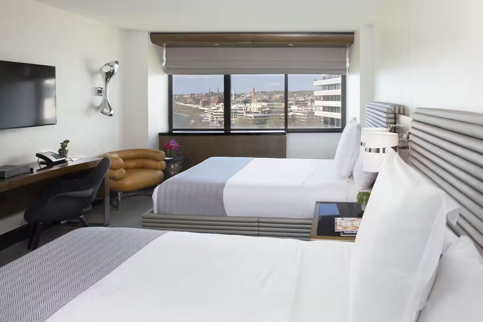 Wake up to city views from a bright, spacious room.