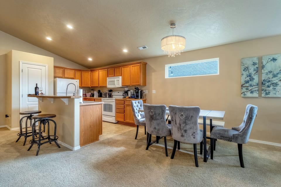 Dining table beside the kitchen, ideal for meals and conversation.