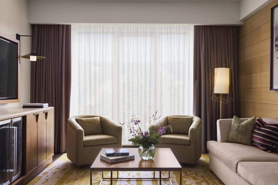 Relax with coffee in the cozy lounge seating by daylight.