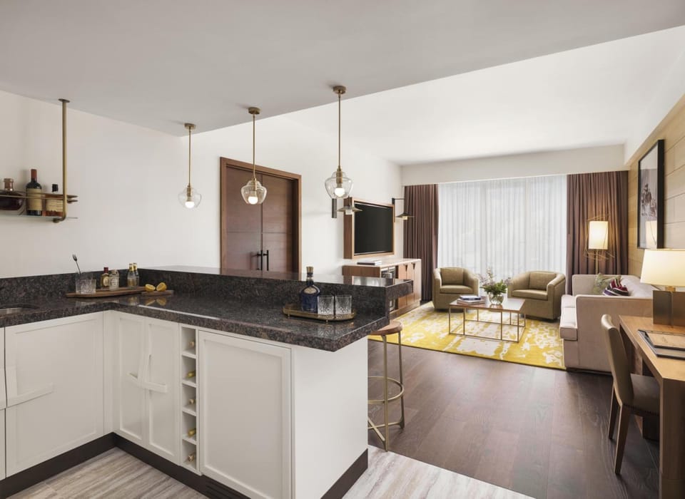 Gather for cocktails in a bright, open-plan suite.