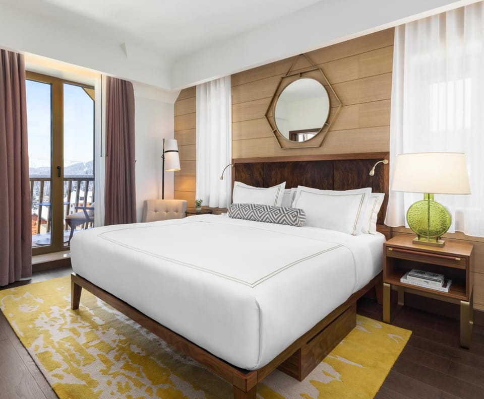 Stretch out in a sunlit king bed with scenic views.