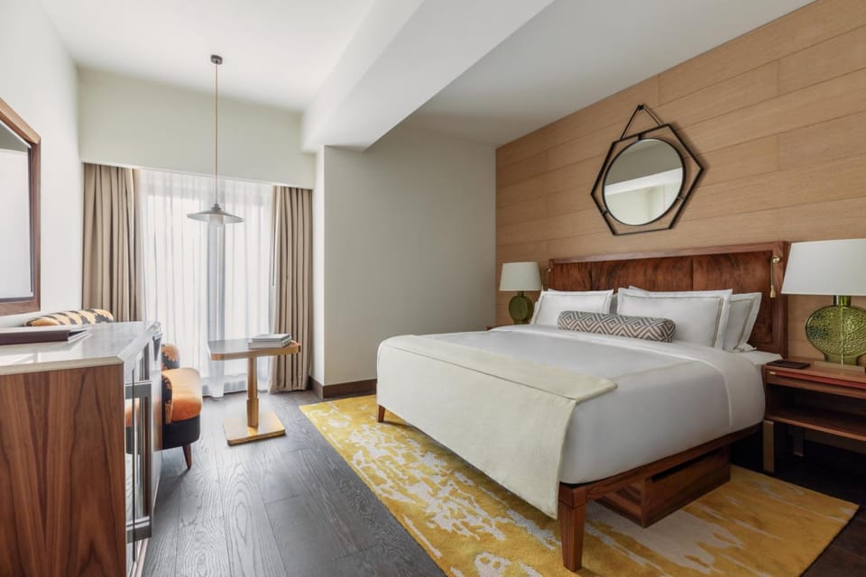 Stretch out in a serene king bed with cozy seating.