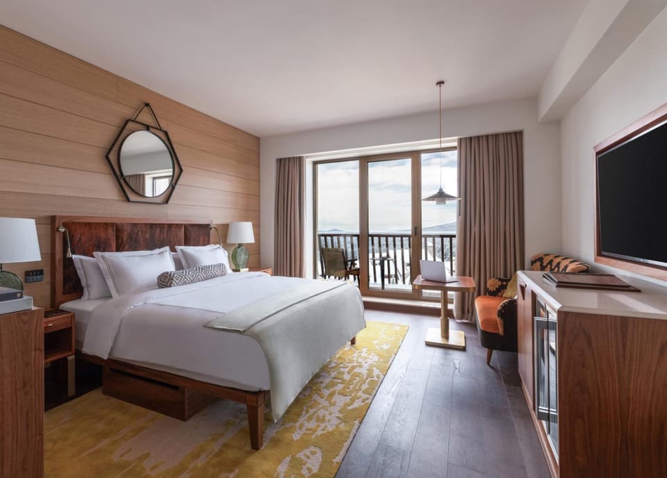 Step onto the balcony and savor sunrise from bed.