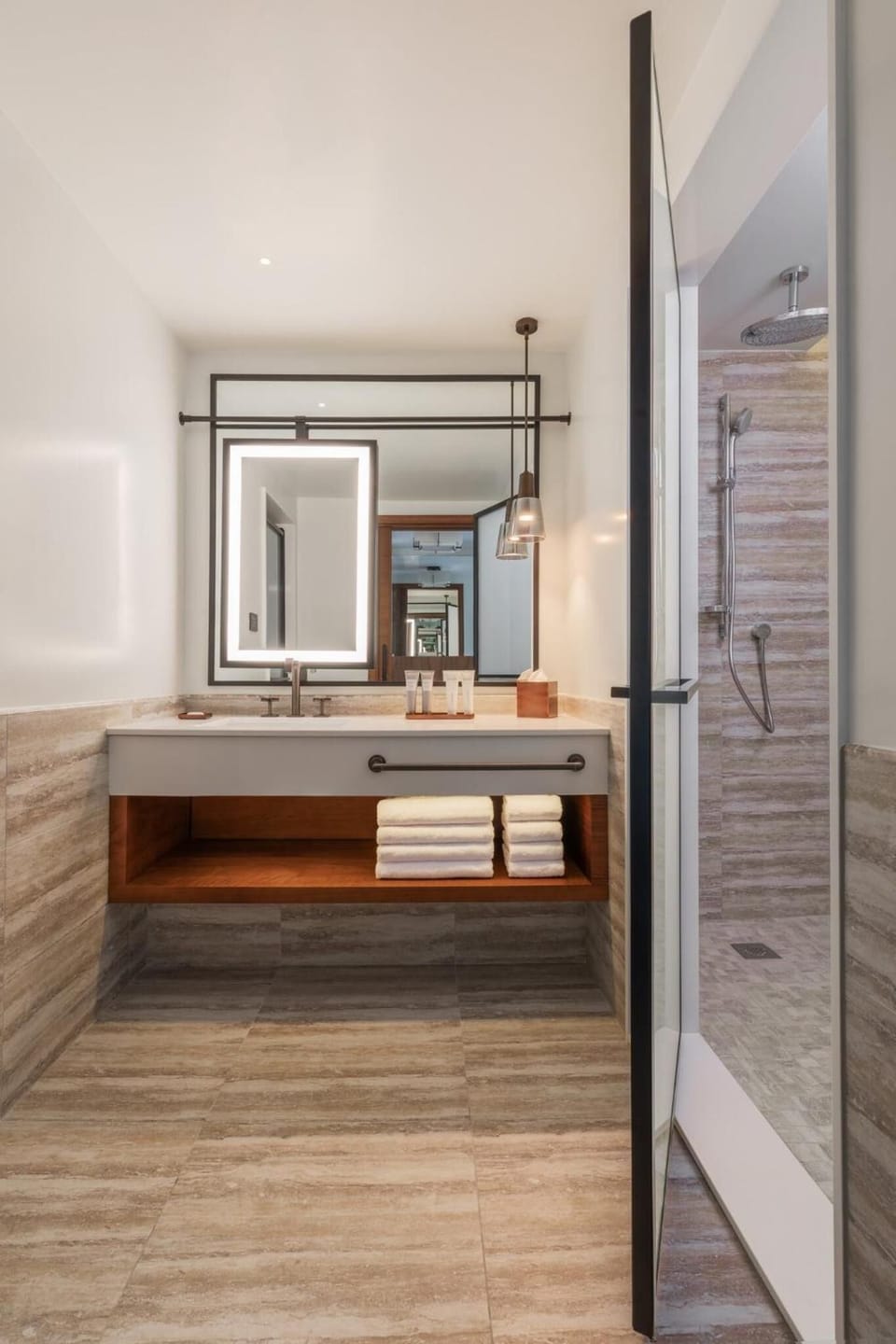 Refresh with a rainfall shower and glowing backlit mirror.