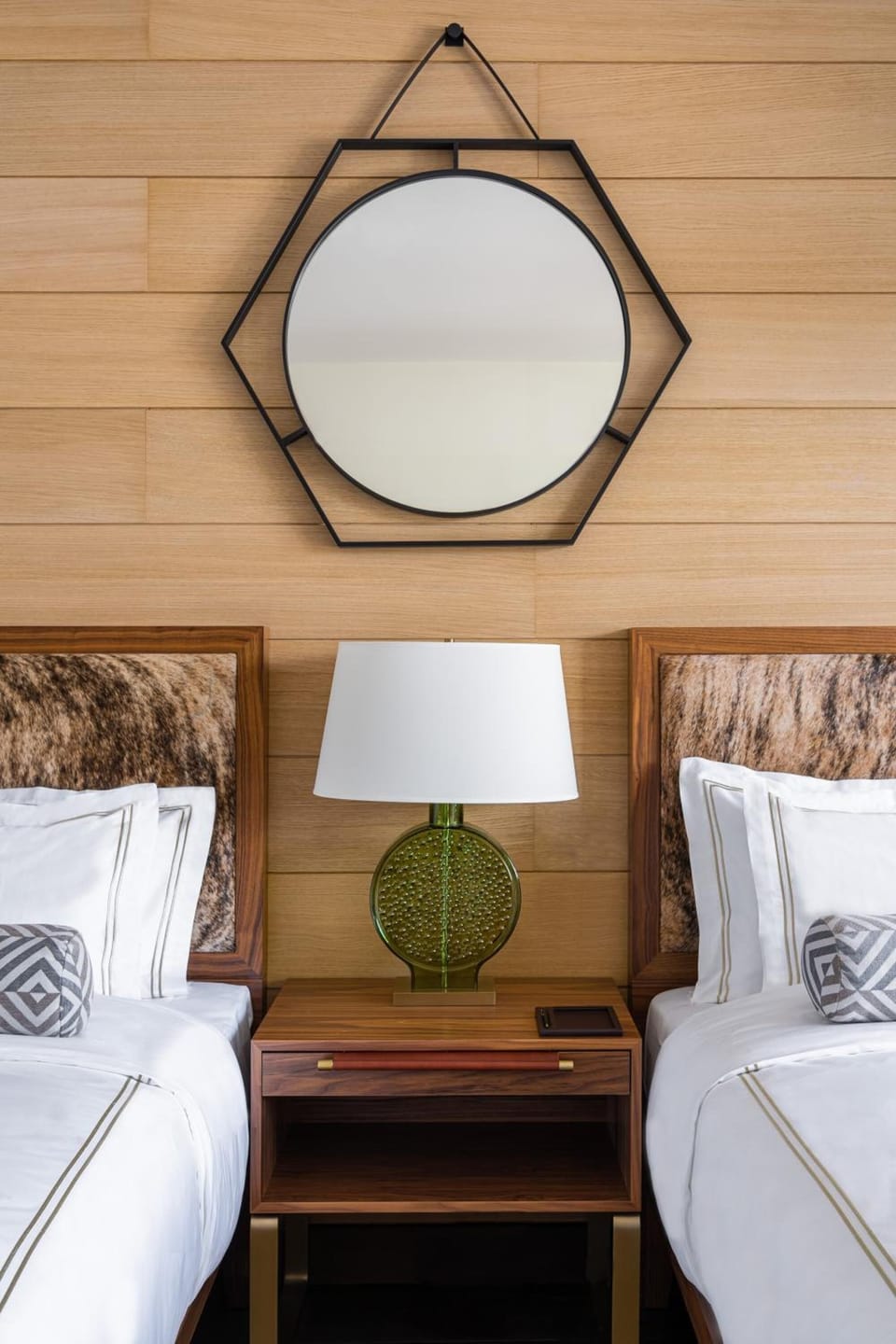 Settle in with warm bedside lighting and thoughtful design details.