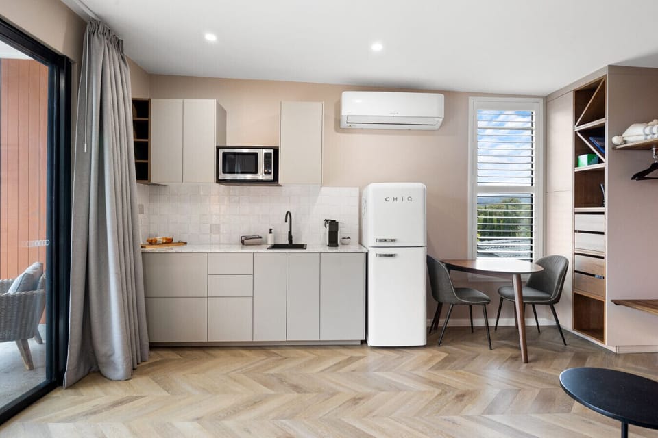 An outdoor grill and a functional kitchen offer the basics you need for casual bites at home