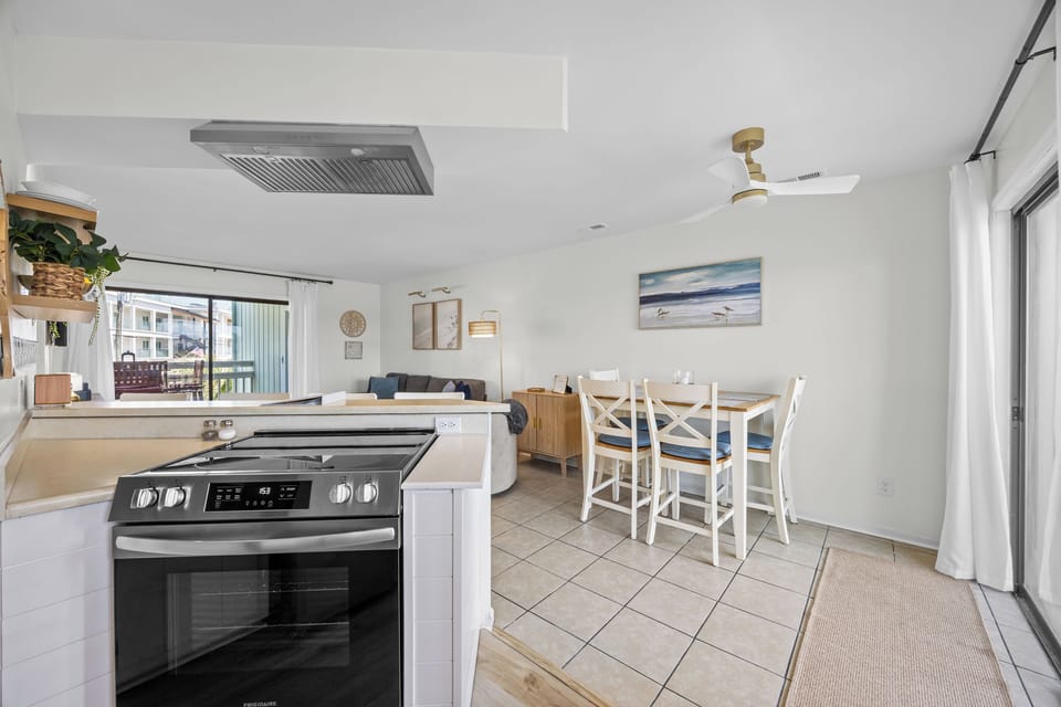 Cook with ease in a well‑stocked kitchen featuring a Keurig, drip coffee maker, and all essentials for meals at home. .