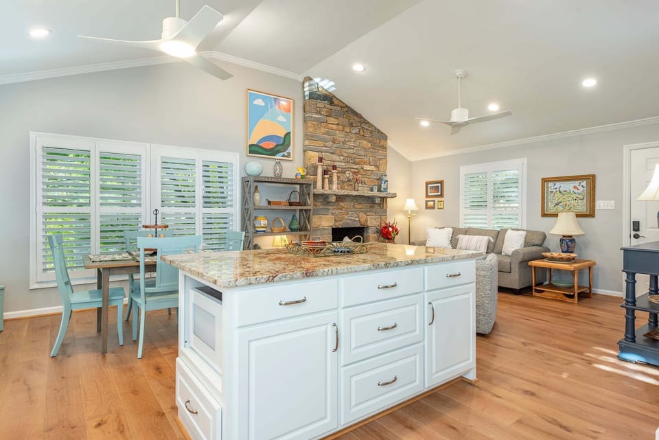 Open living, dining, and kitchen areas.