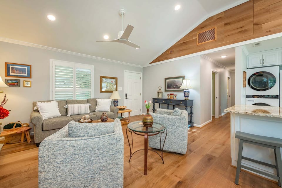 Open living, dining, and kitchen areas.
