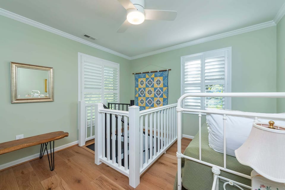Bedroom with a Twin bed. Note: There is a long-term tenant occupying the lower-level apartment.