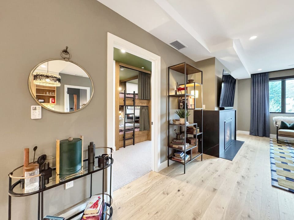 A dedicated bar area that sets the tone for the night, and just beyond, a private guest room waiting. This is a home that knows how to host and how to make everyone feel welcome