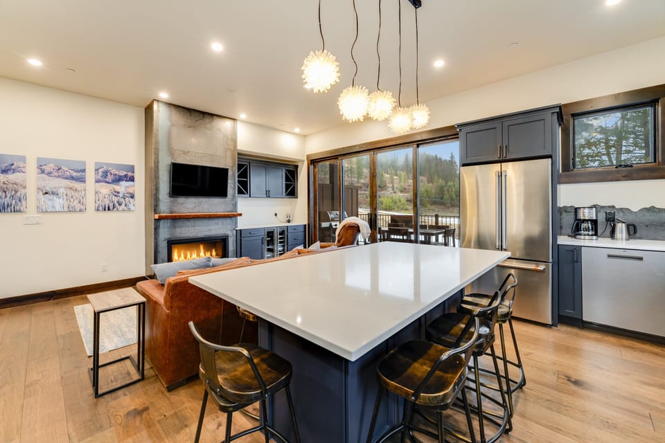 Gather around the island to enjoy your favorite meal. | Main Level