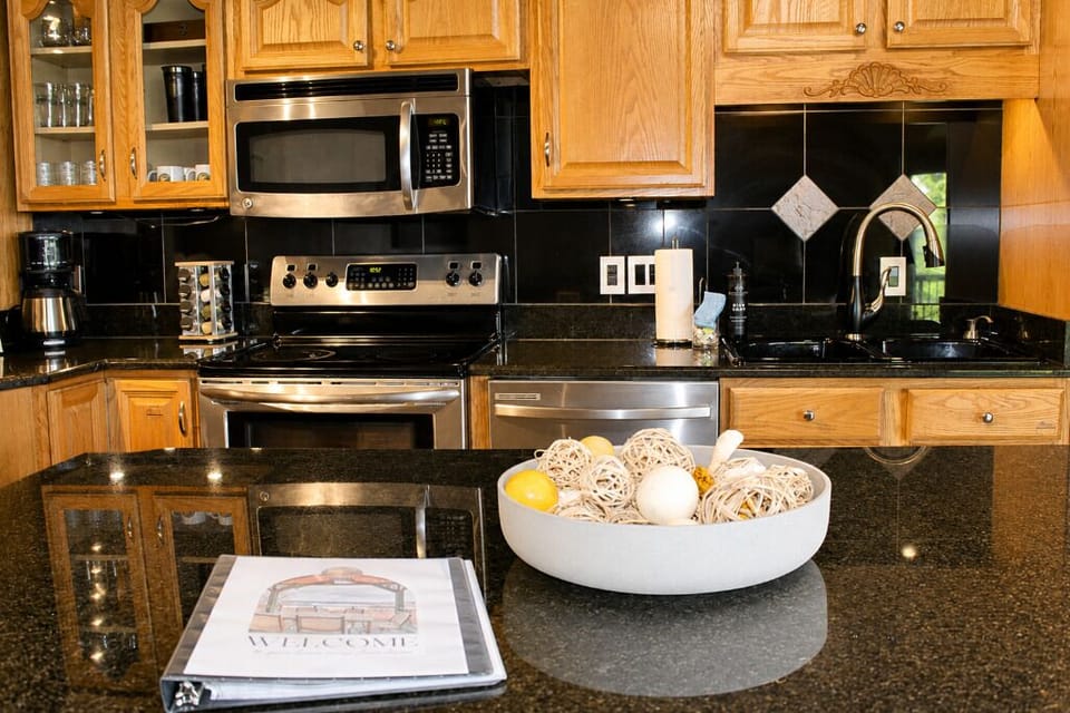 Full kitchen with cooktop, oven, and dishwasher for guest use.