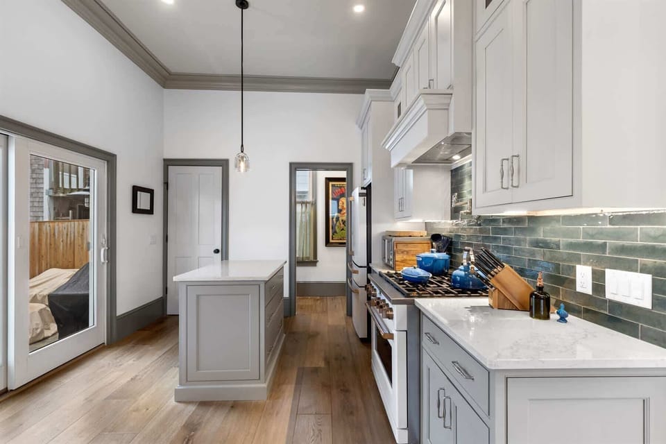 The well equipped kitchen features quality finishes, a central island, and a layout designed for easy cooking and entertaining.