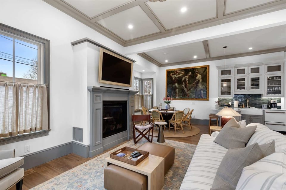 From the living room, enjoy an easy connection to the dining area and chefs kitchen, ideal for relaxed vacation living.