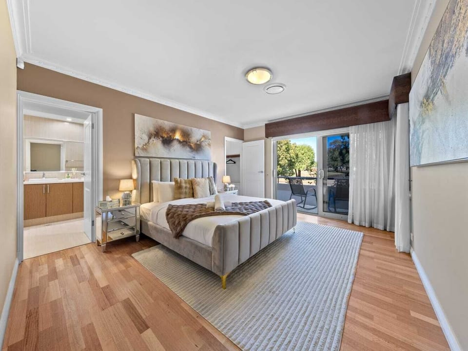 Luxury master suite, primary bedroom with balcony, ensuite bedroom, king-size guest room.