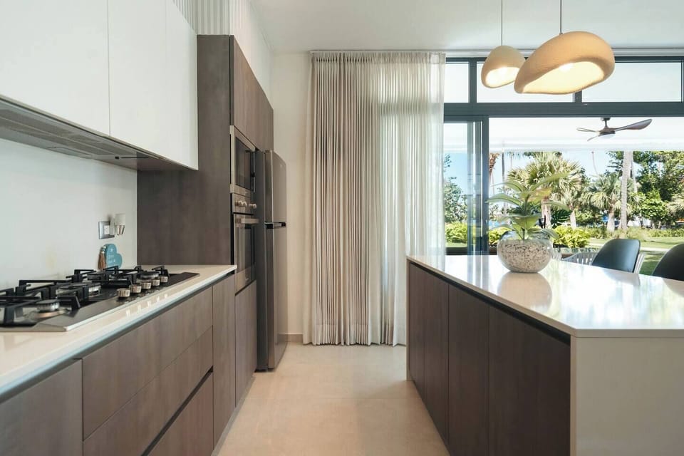 A bright, fully equipped kitchen with plenty of space to cook and gather.