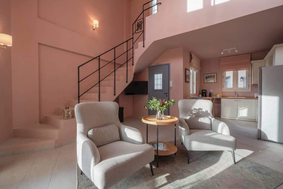 Chic living space with staircase, leading to the top floor