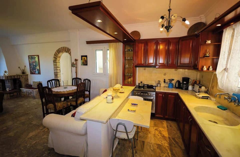 Fully equipped kitchen with ample counter space and traditional cabinetry.