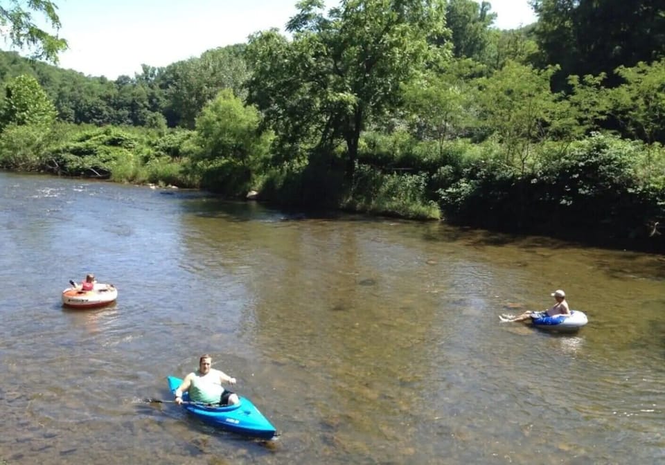 Guests enjoy fishing, tubing, & kayaking in the North Toe River on our property!