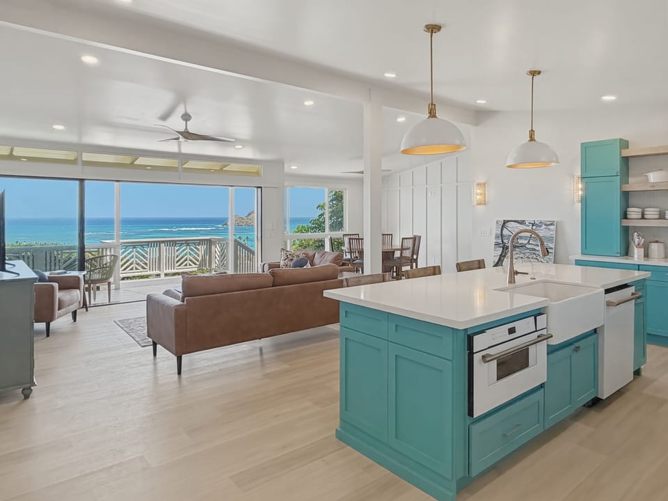 Take in breathtaking ocean views from this stunning open-concept space, where your turquoise kitchen island becomes the heart of coastal living.