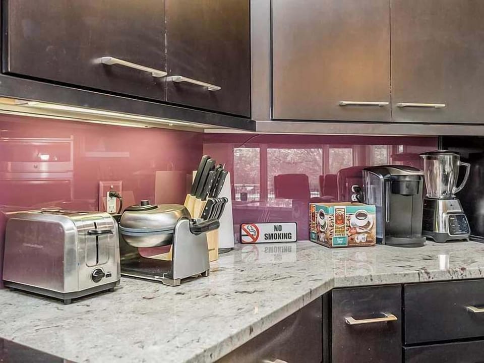 Stylish kitchen corner w/ ample counter space, cabinetry & modern finishes