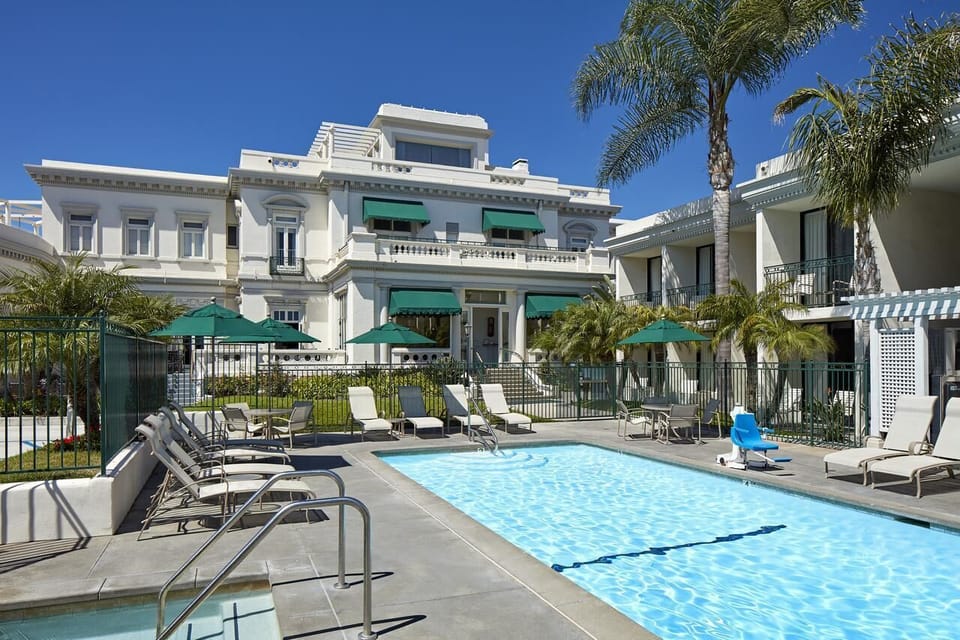Dive into sunshine and lounge poolside under swaying palms.