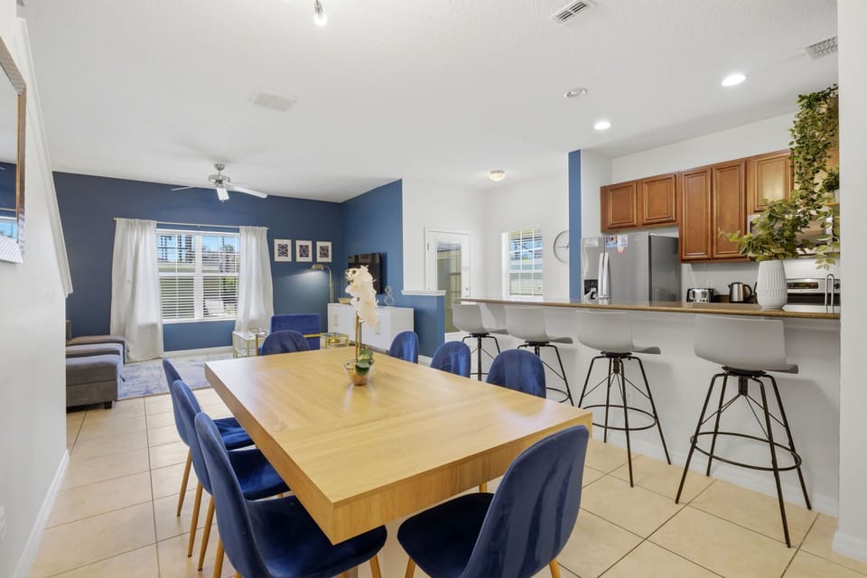 Open-concept living with a fully equipped kitchen and large dining space—perfect for family meals and late-night planning sessions.