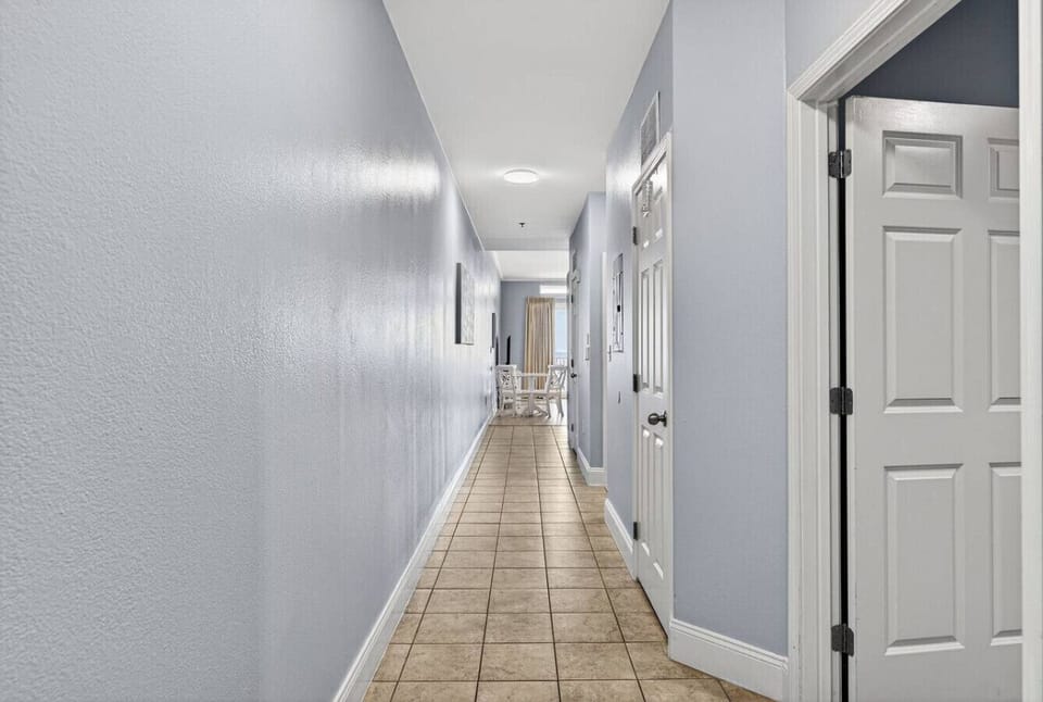 Long hallway leading to the living space, creating a bright and open layout.