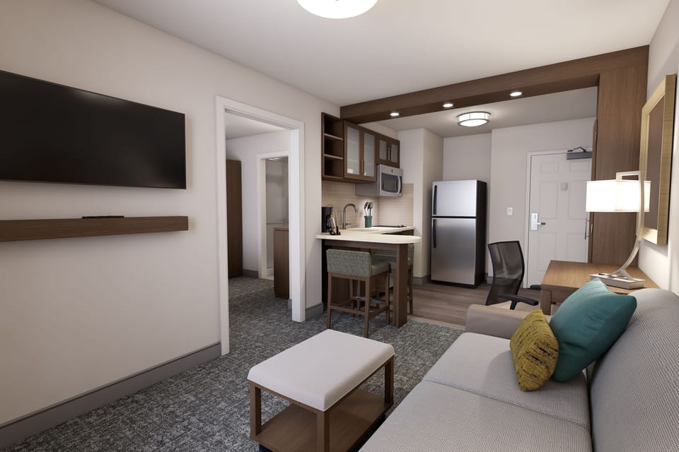 Inviting suite with a kitchen nook and comfortable seating area.
