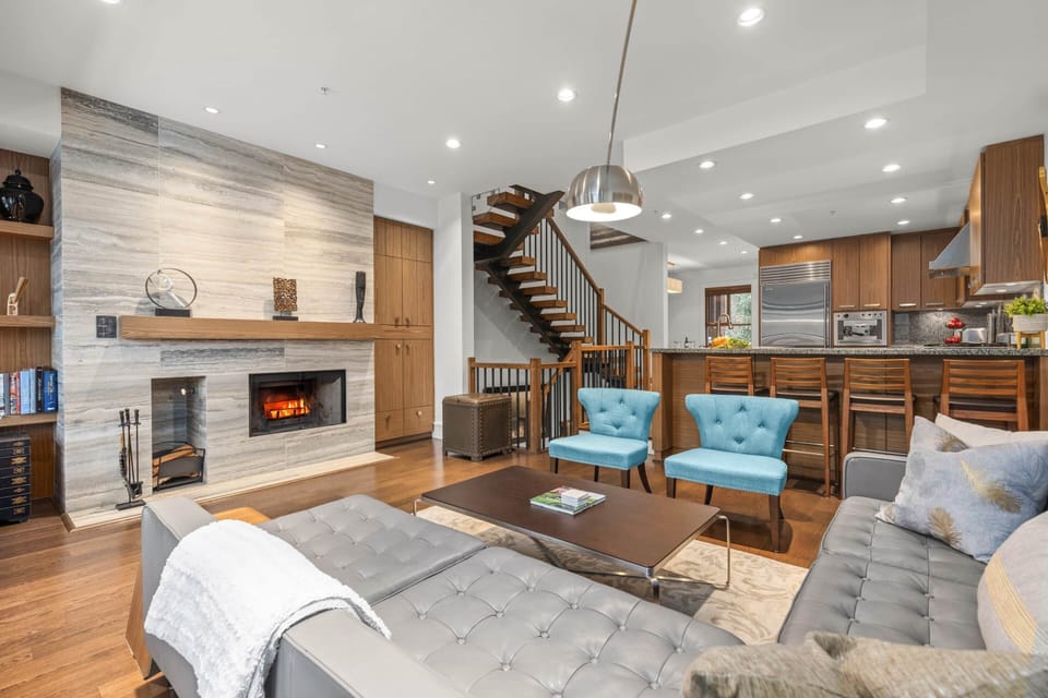 - Modern living area with wood-burning fireplace and sumptuous seating