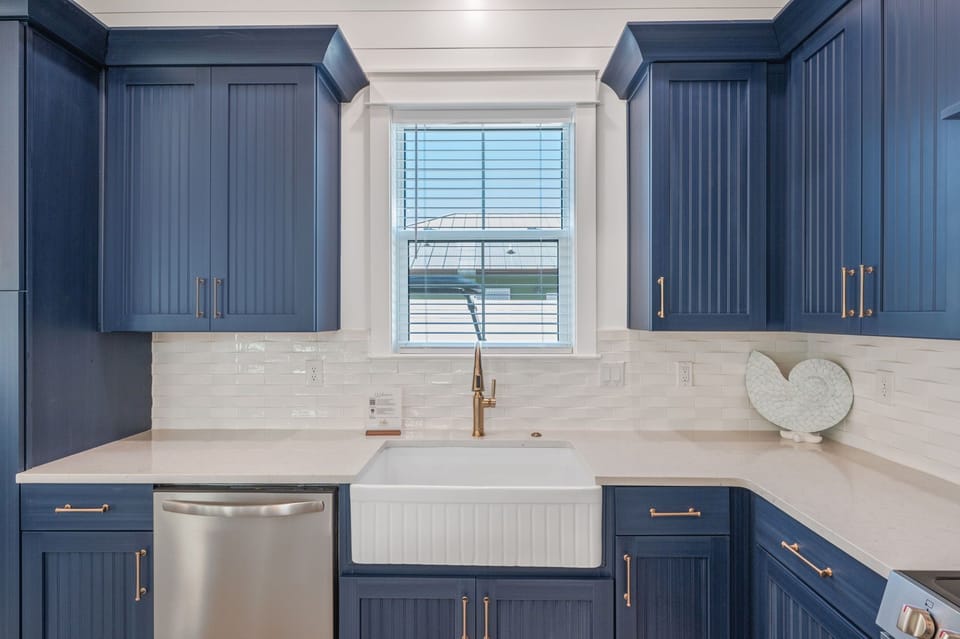 Farmhouse sink and professionally designed accents make you feel right at home
