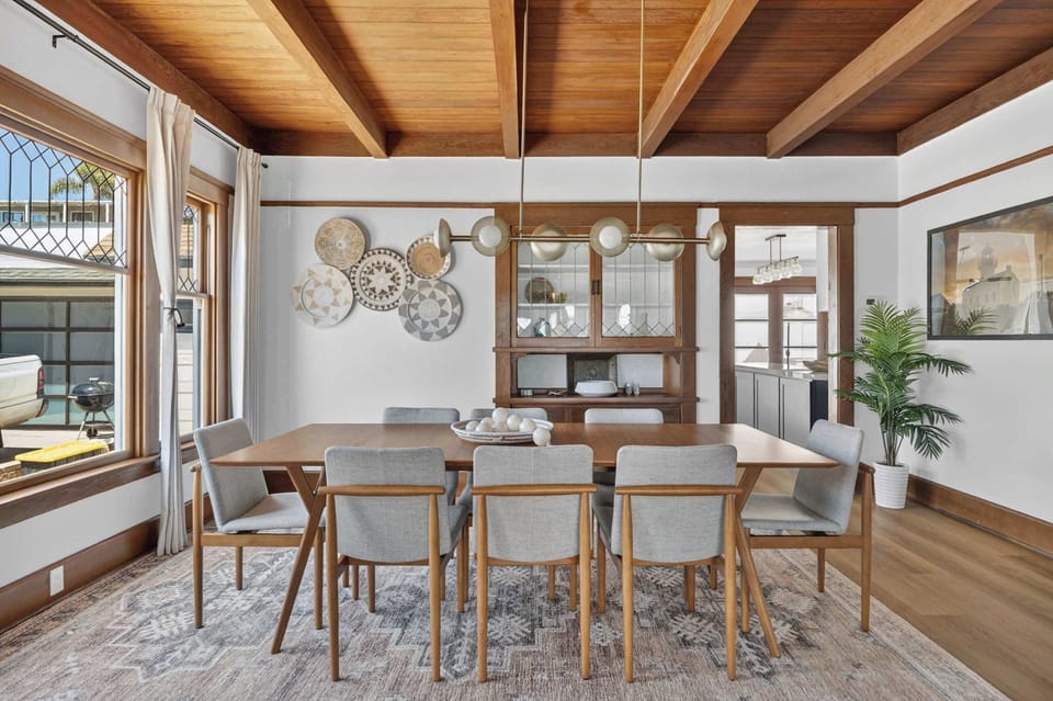 Elegant dining space with warm wood accents and seating for the whole group.