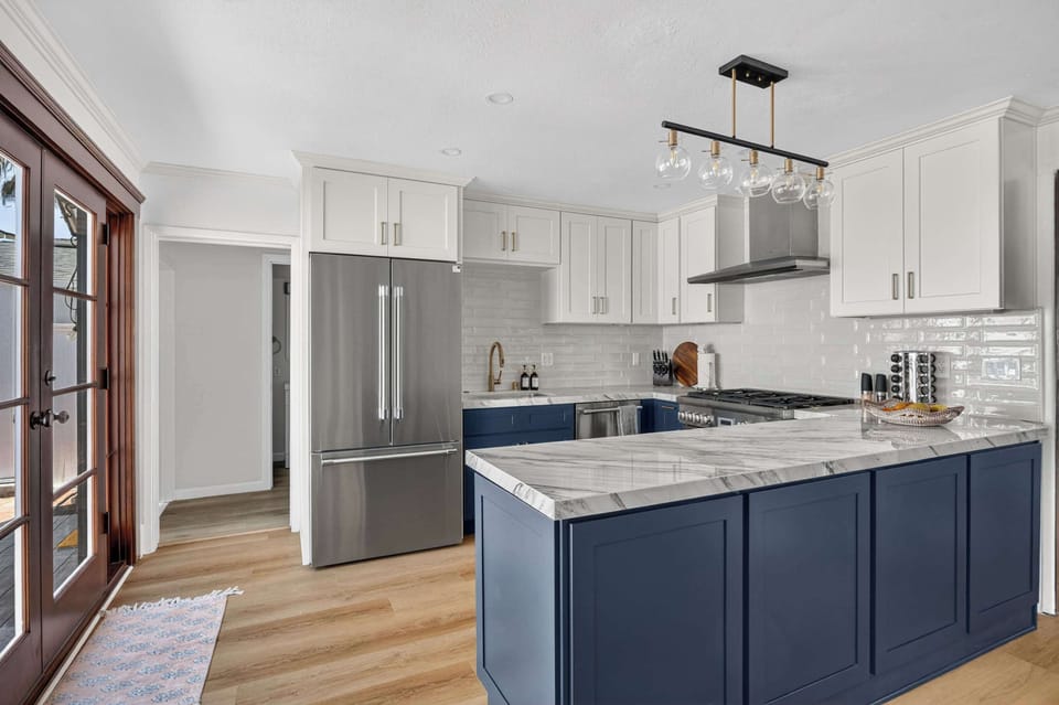 Spacious, modern kitchen with a large island and sleek finishes.