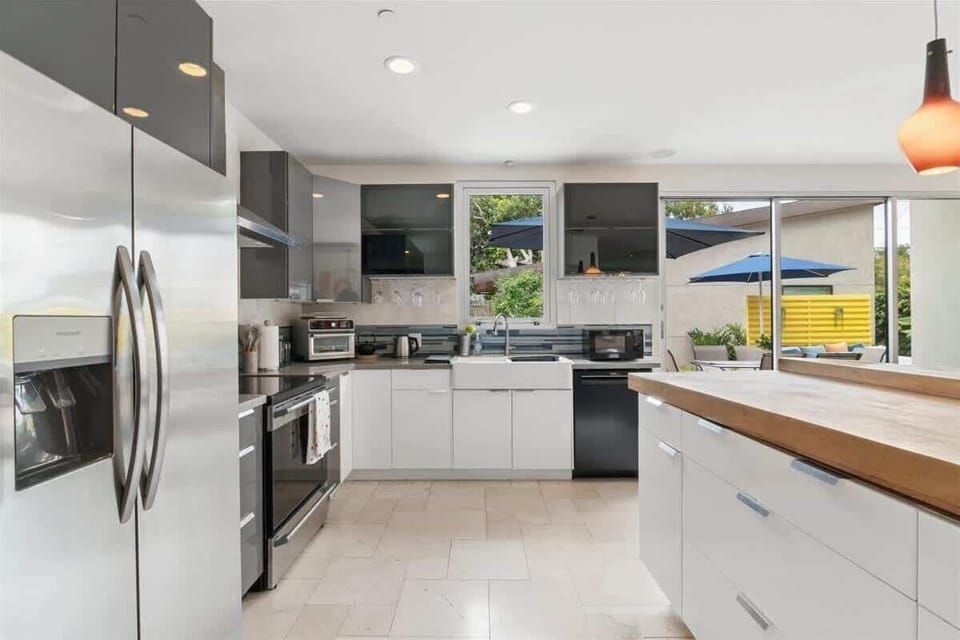 Enjoy the open and modern kitchen with beautiful design and natural light.