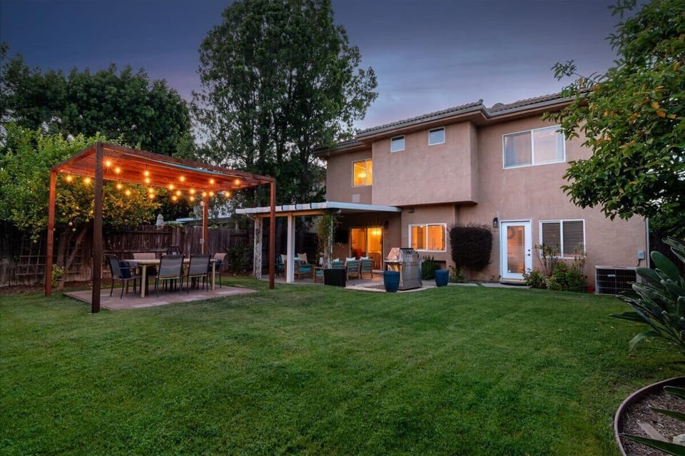 Large grassy backyard with plenty of space for enjoying the property comfortably