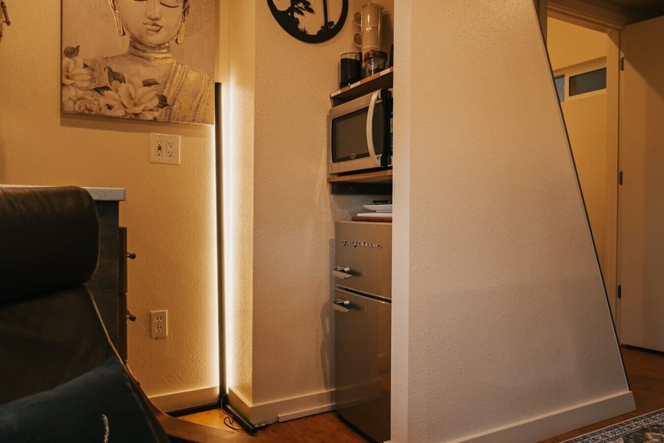 Efficiently designed compact kitchen with a retro refrigerator.