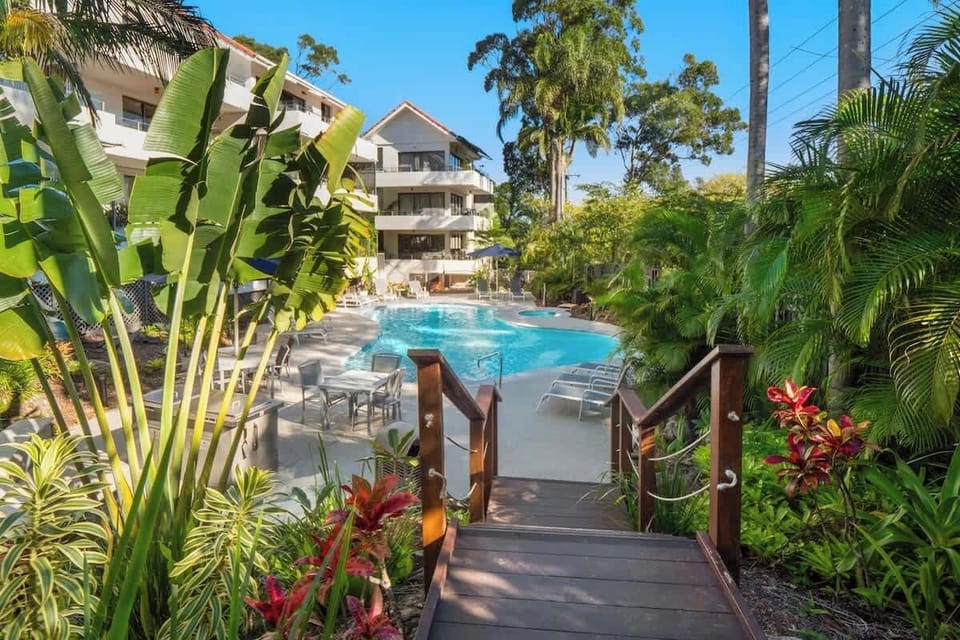 Huge resort pool with sun loungers and BBQ. 