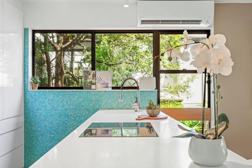Light and spacious fully equipped kitchen with modern appliances.