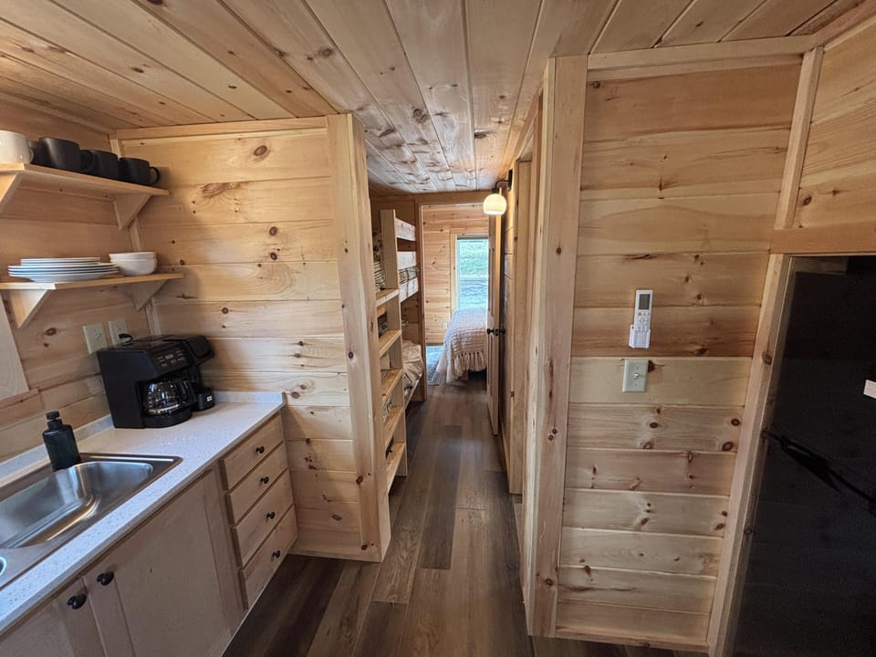 Cozy cabin kitchen with warm wood accents and modern amenities