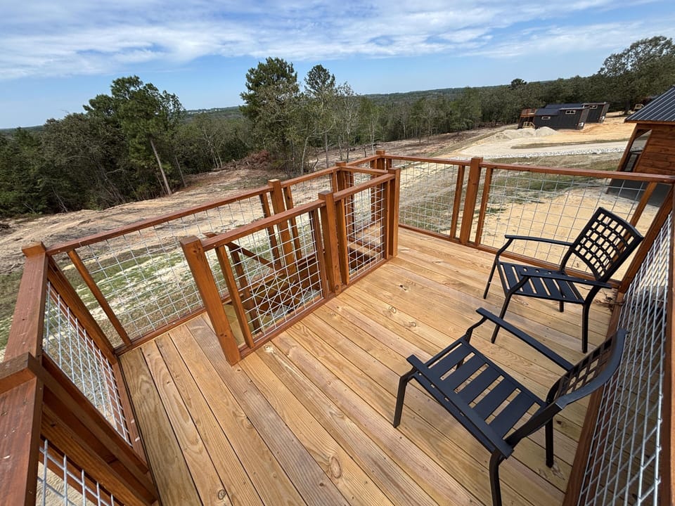 Spacious outdoor deck with scenic views and cozy seating