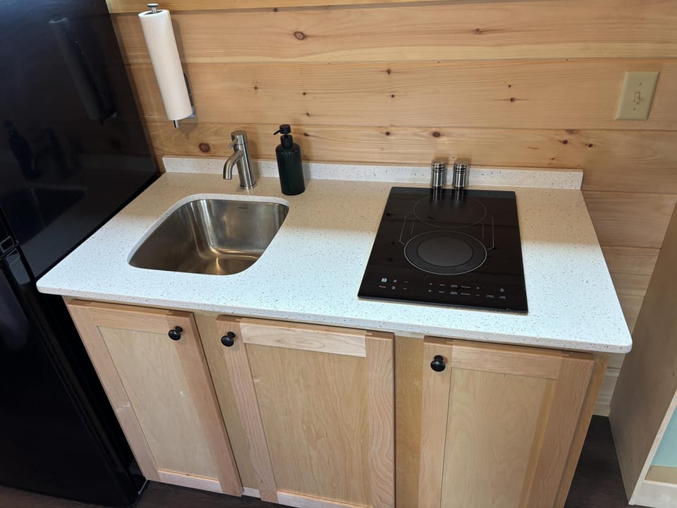 Cozy kitchenette with sleek cooktop and modern sink
